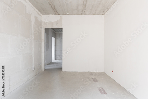 interior of the apartment without decoration in gray colors. rough finish