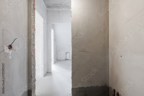 interior of the apartment without decoration in gray colors. rough finish