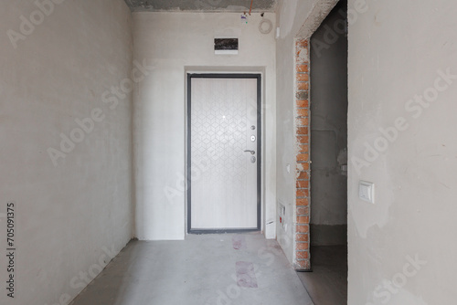 interior of the apartment without decoration in gray colors. rough finish