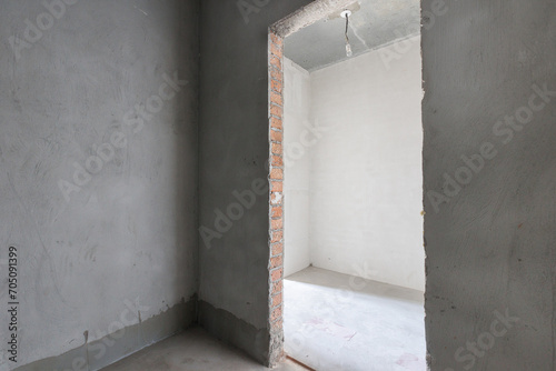 interior of the apartment without decoration in gray colors. rough finish