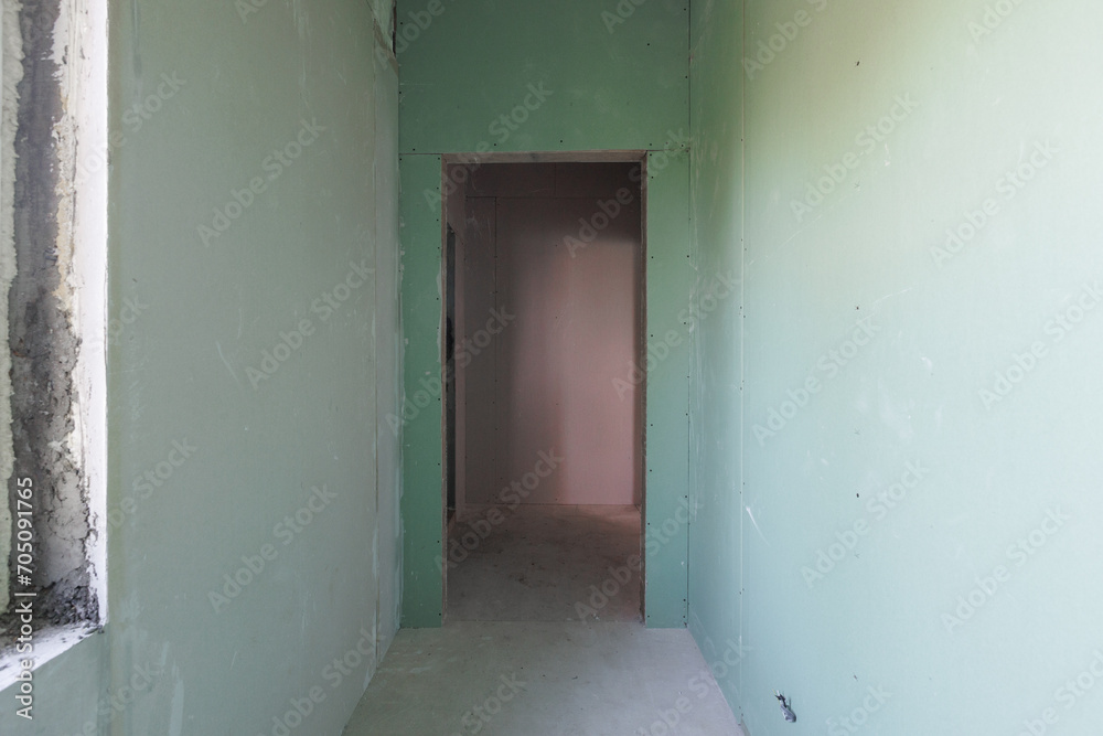 interior of the apartment without decoration in gray colors. rough finish interior of the apartment without decoration in gray colors. rough finish