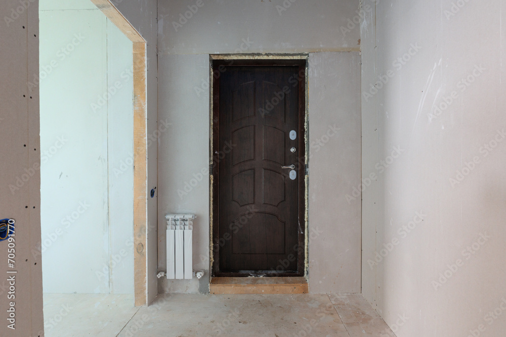 Fototapeta premium interior of the apartment without decoration in gray colors. rough finish