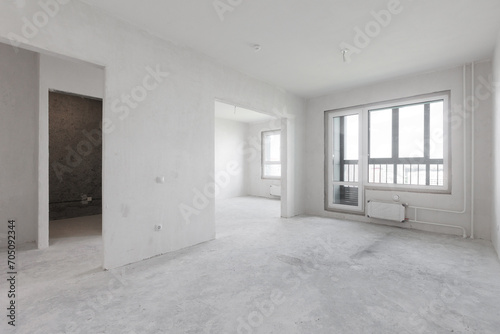 interior of the apartment without decoration in gray colors. rough finish