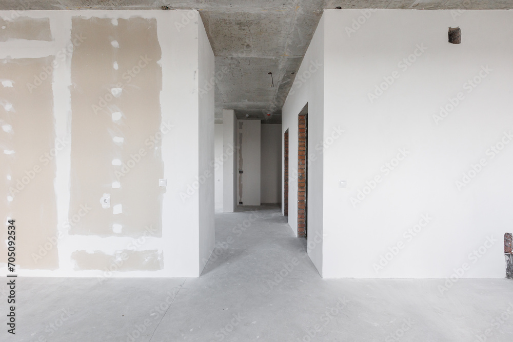 interior of the apartment without decoration in gray colors. rough finish interior of the apartment without decoration in gray colors. rough finish