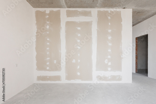 interior of the apartment without decoration in gray colors. rough finish