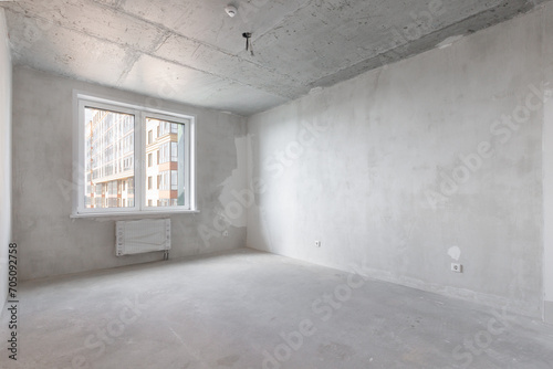 interior of the apartment without decoration in gray colors. rough finish