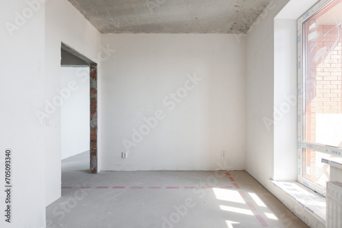 interior of the apartment without decoration in gray colors. rough finish