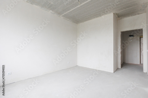 interior of the apartment without decoration in gray colors. rough finish