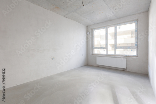 interior of the apartment without decoration in gray colors. rough finish © gluschenkoart