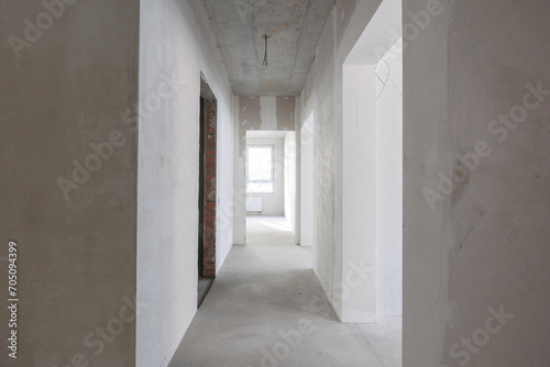 interior of the apartment without decoration in gray colors. rough finish