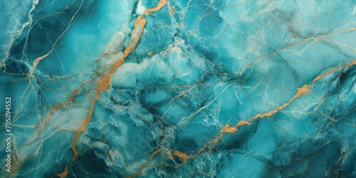 Close up texture of turquoise marble with intricate gold and white veins.