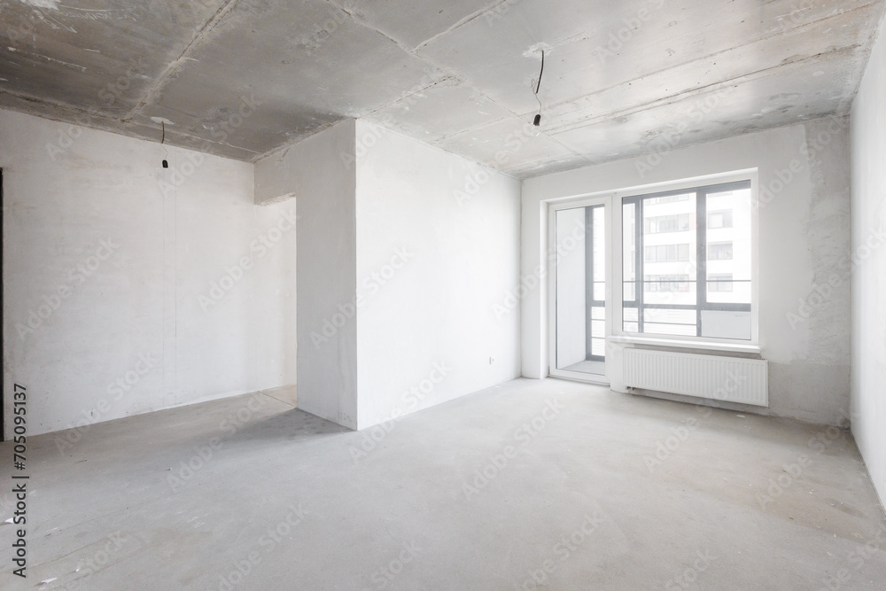 interior of the apartment without decoration in gray colors. rough finish
