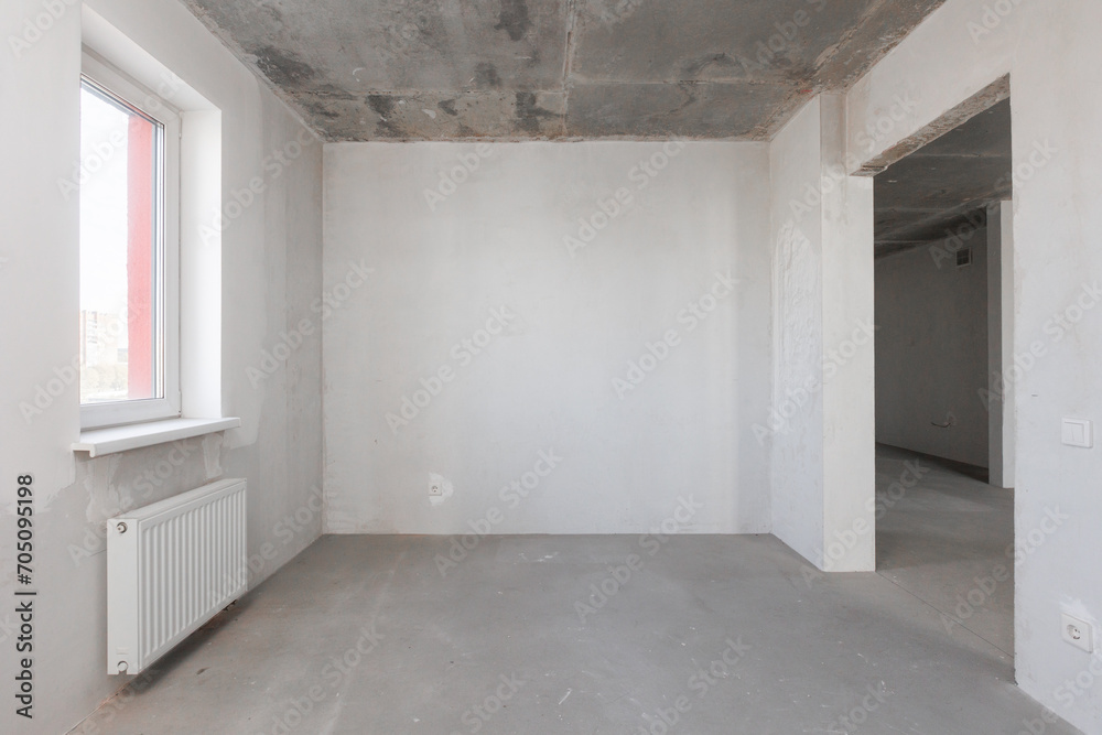 interior of the apartment without decoration in gray colors. rough finish