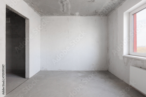 interior of the apartment without decoration in gray colors. rough finish