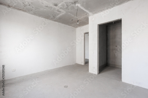 interior of the apartment without decoration in gray colors. rough finish