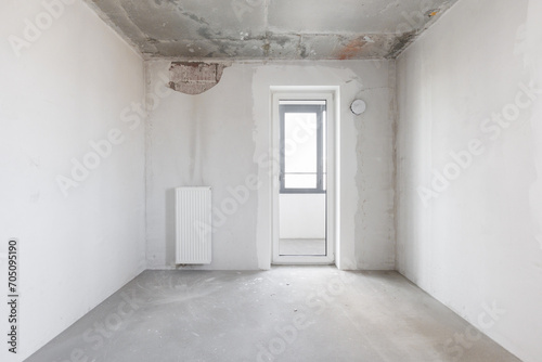 interior of the apartment without decoration in gray colors. rough finish