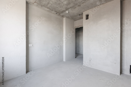 interior of the apartment without decoration in gray colors. rough finish