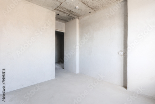 interior of the apartment without decoration in gray colors. rough finish