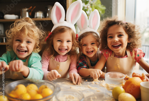 Little friends cooking biscuits wearing bunny diadem