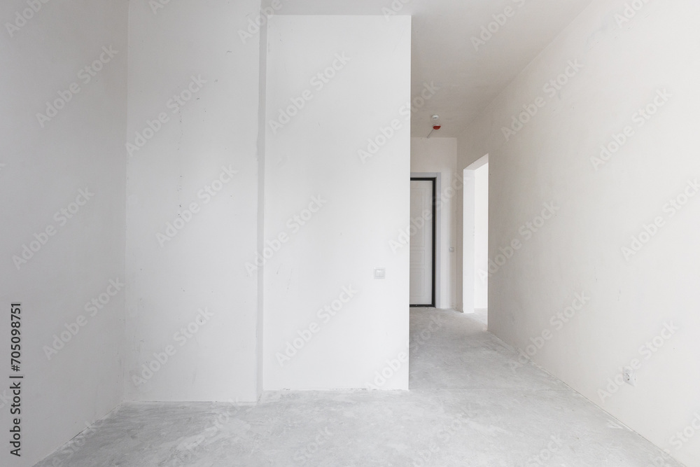 Fototapeta premium interior of the apartment without decoration in gray colors. rough finish