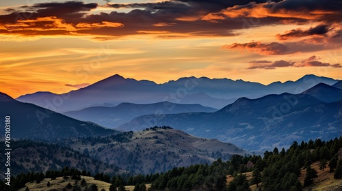 Rocky mountain range glowing under the warm tones of a sunset