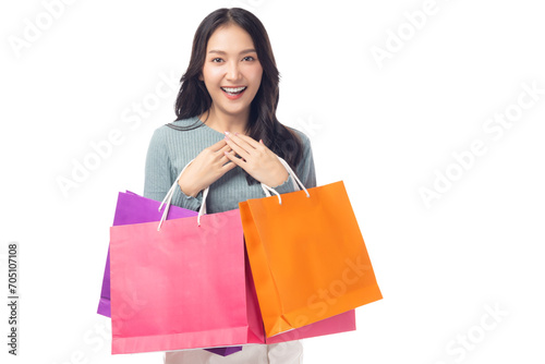 Portrait excited beautiful asian woman holding shopping bags isolated on white background and copy space Surprise happy asian lady open mouth with excited Beauty young female love shopping