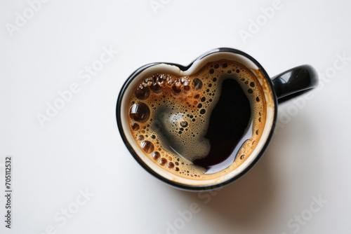Top View Of White Background Heart Shaped Cup With Coffee © Anastasiia