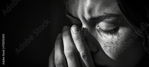 Monochrome image of a woman in tears with copy space photo