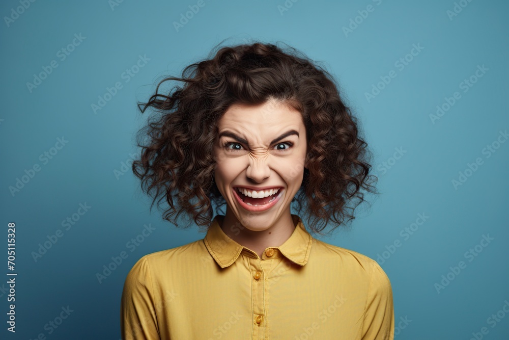 grimacing woman posing in a studio in front of the camera grimacing woman posing in a studio in front of the camera