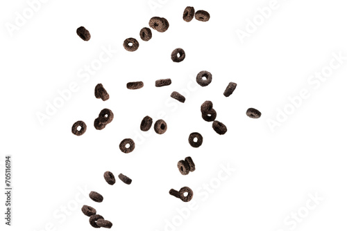Chocolate rings cereal spill out into a bowl. Breakfast.