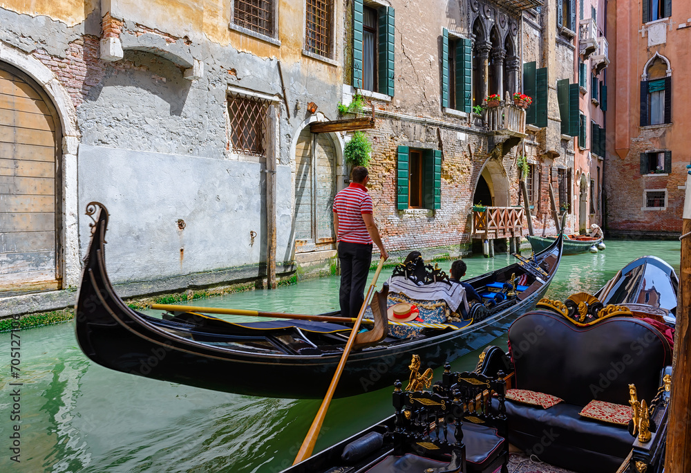 Narrow canal with gondola in Venice, Italy. Architecture and landmark of Venice. Cozy cityscape of Venice. - obrazy, fototapety, plakaty 