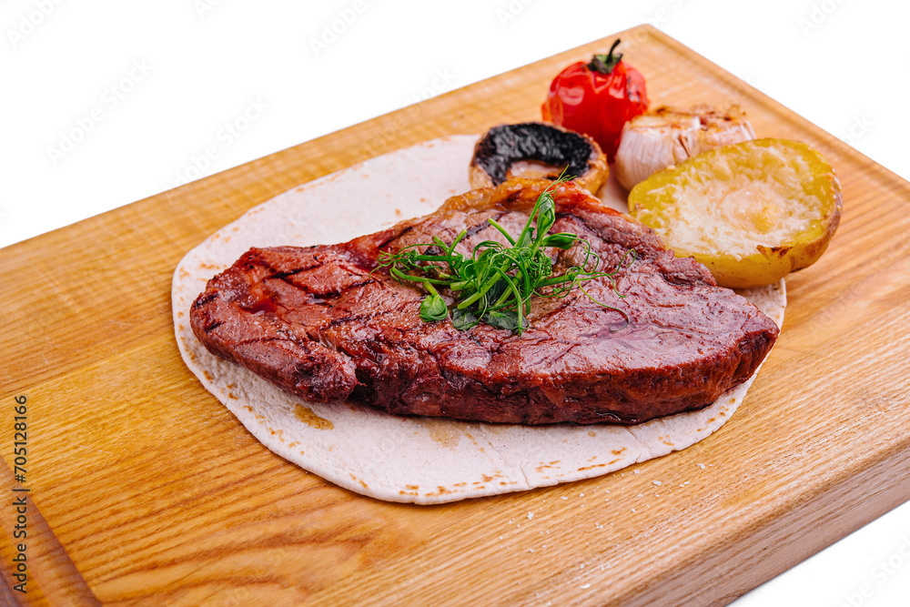 Delicious grilled pork chop on pita bread Delicious grilled pork chop on pita bread