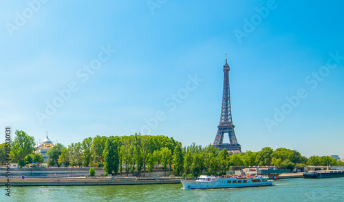 Blue sky over Seine River and world famous Eiffel Tower in Paris © Gabriele Maltinti