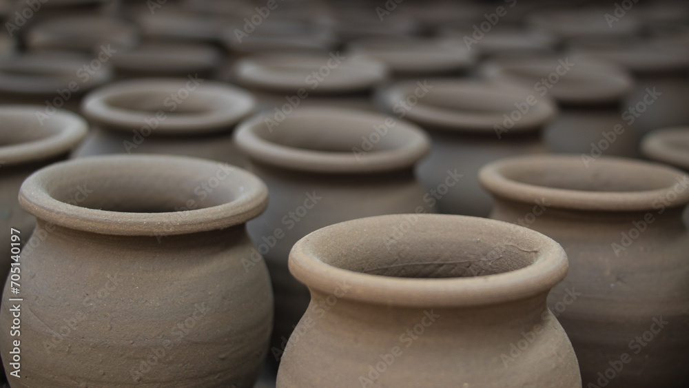 Pottery making involves shaping clay by hand, using a wheel, or coiling techniques.