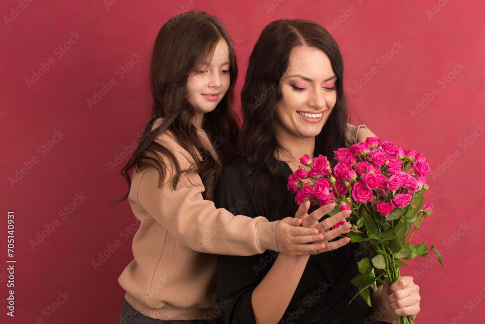 Beautiful girl with a bouquet of small pink roses Beautiful girl with a bouquet of small pink roses