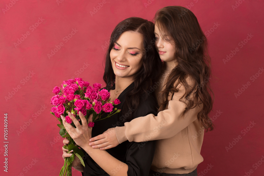 Beautiful girl with a bouquet of small pink roses Beautiful girl with a bouquet of small pink roses