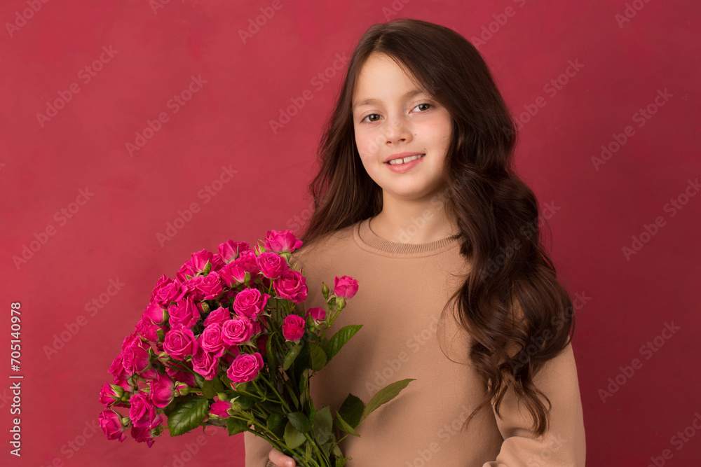 Beautiful girl with a bouquet of small pink roses Beautiful girl with a bouquet of small pink roses