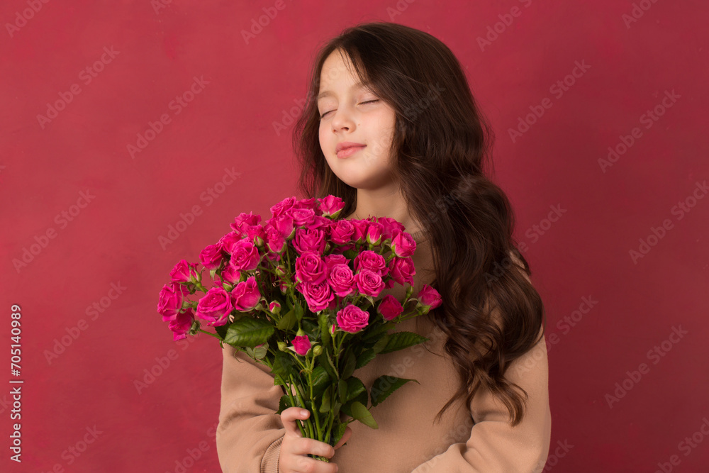 Beautiful girl with a bouquet of small pink roses Beautiful girl with a bouquet of small pink roses