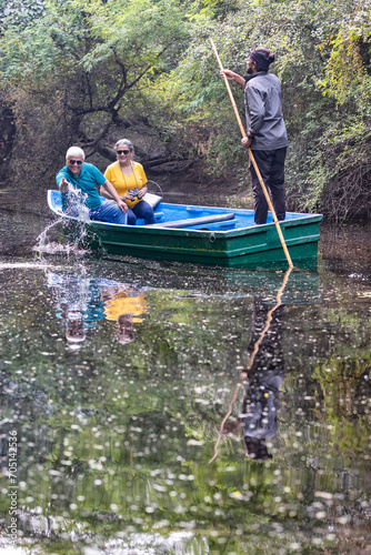 Senior couple tourist traveling on boat at lake