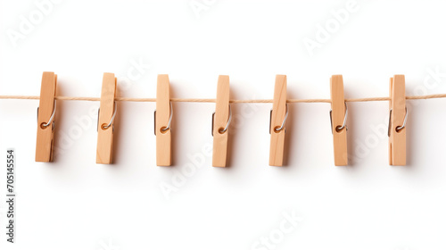 clothespin on a rope, Wooden clothes pins hanging on brown rope isolated on white background Ai generated image