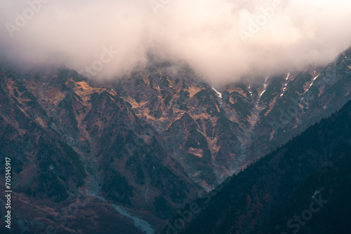 Nature mountain landscape panorama view with snow  travel in Japan forest peak scenic with blue sky and winter white cloud  beautiful tree and cold ice scenery  outdoor hiking vacation in Kamikochi