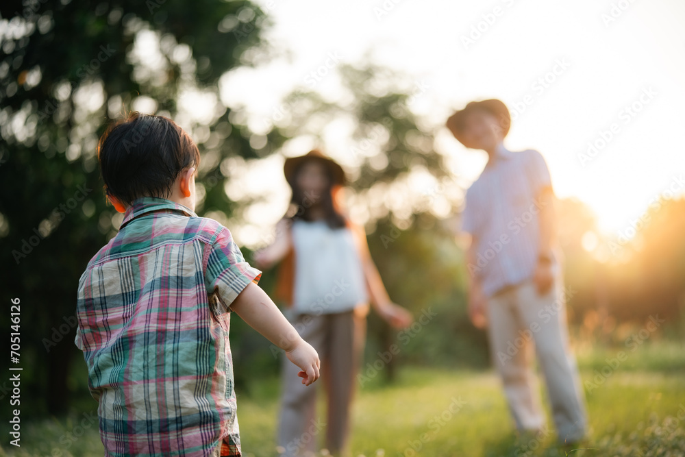 happy harmonious Asian family outdoors concept, Asian mother and son have activities happy fun together on holidays, grass land with sunlight happy harmonious Asian family outdoors concept, Asian mother and son have activities happy fun together on holidays, grass land with sunlight