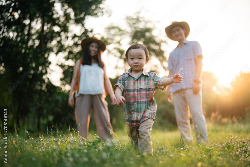 Happy Asian father mother and daughter enjoy camping together at countryside, camping lifestyle with glamping tent Happy Asian father mother and daughter enjoy camping together at countryside, camping lifestyle with glamping tent
