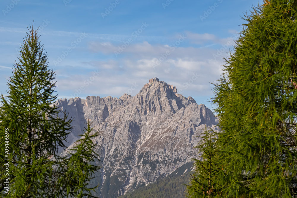 Scenic view of steep mount Haunold in majestic mountain range of untamed Sexten Dolomites, South Tyrol, Italy, Europe. Hiking concept in Italian Alps. Looking from top lift station of Helmjet Sexten