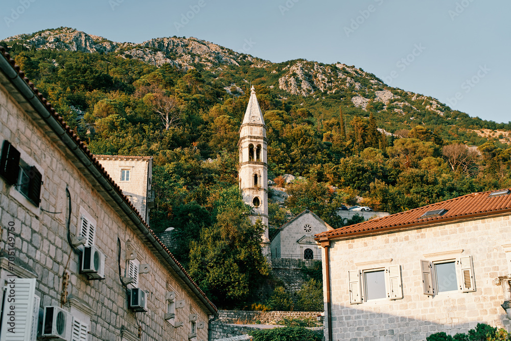 Bell tower of the Church of Our Lady of the Rosary on the mountainside. Perast, Montenegro