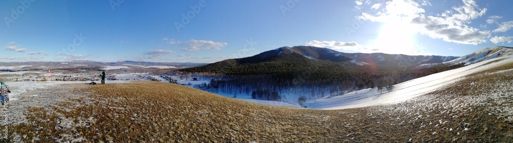Panorama of mountains in winter, mountain ranges, winter landscape.