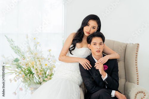 Groom and bride together, exuding elegance and joy in a bright wedding portrait setting - Pre wedding posed for photography