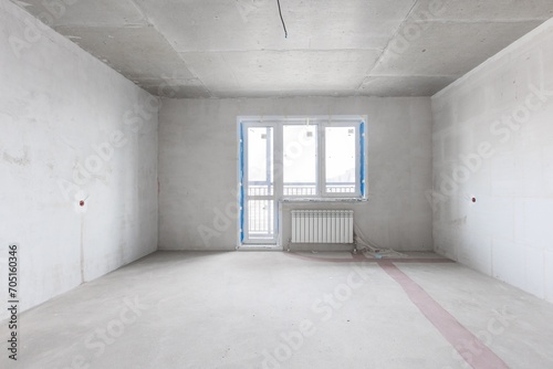 interior of the apartment without decoration in gray colors. rough finish