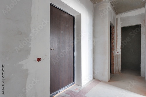 interior of the apartment without decoration in gray colors. rough finish