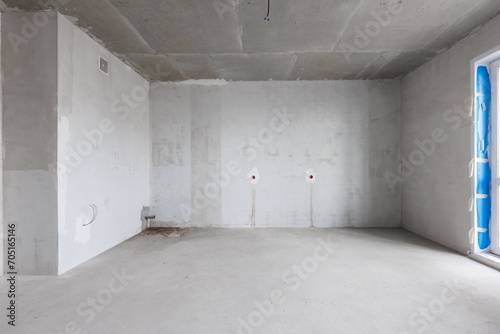 interior of the apartment without decoration in gray colors. rough finish